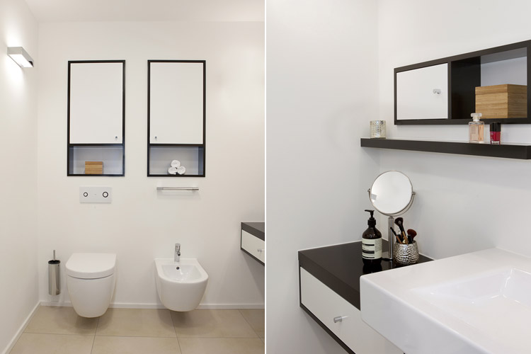 Bad-En-Suite mit hellem Fliesenboden und Einbauschränken mit Hänge-WC und Bidet in Düsseldorf-Oberkassel